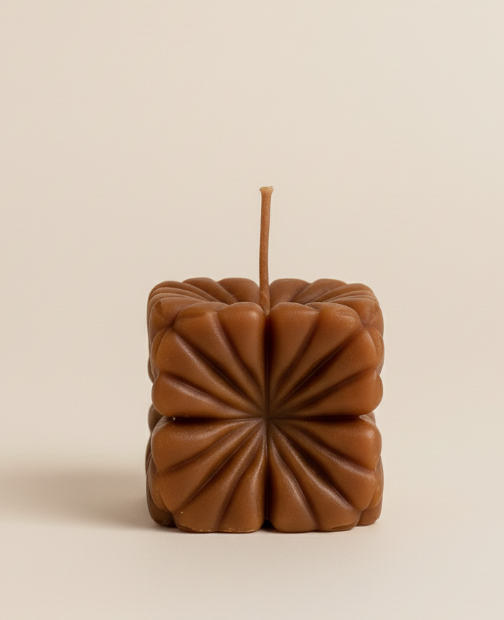 Brown textured square candle on a beige background with 'Butterfly Whispers' branding.